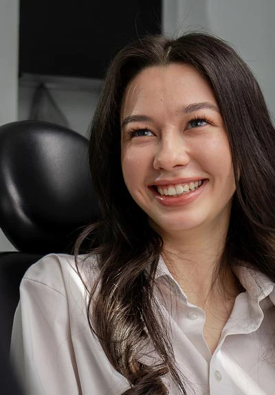 woman smiling at her visit to Lee Dentistry