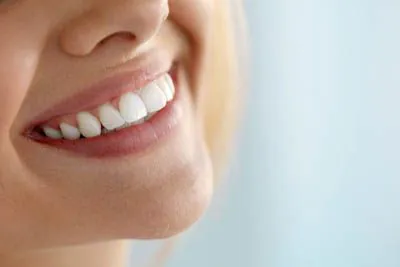 patient smiling after periodontal care from Lee Dentistry