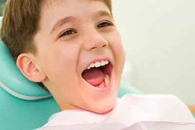 child smiling during his dental appointment at Lee Dentistry