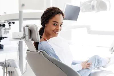 woman smiling during her visit to Lee Dentistry